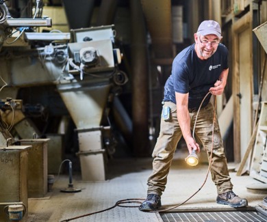 man taking sample in silo