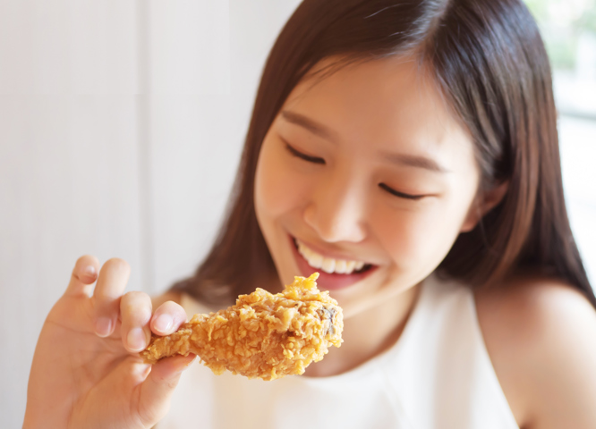 Female eating chicken